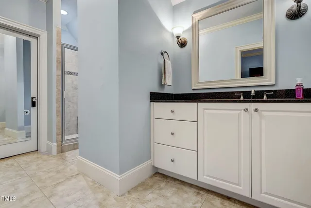 a front view of a house with swimming pool and sitting area