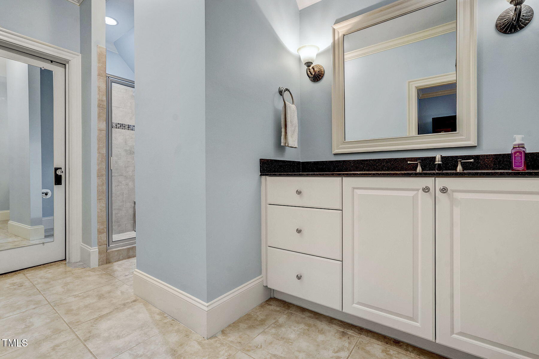 1605 Hunting Ridge Road Raleigh, NC 27615 - Photo 34 of 55 a bathroom with a sink and a mirror