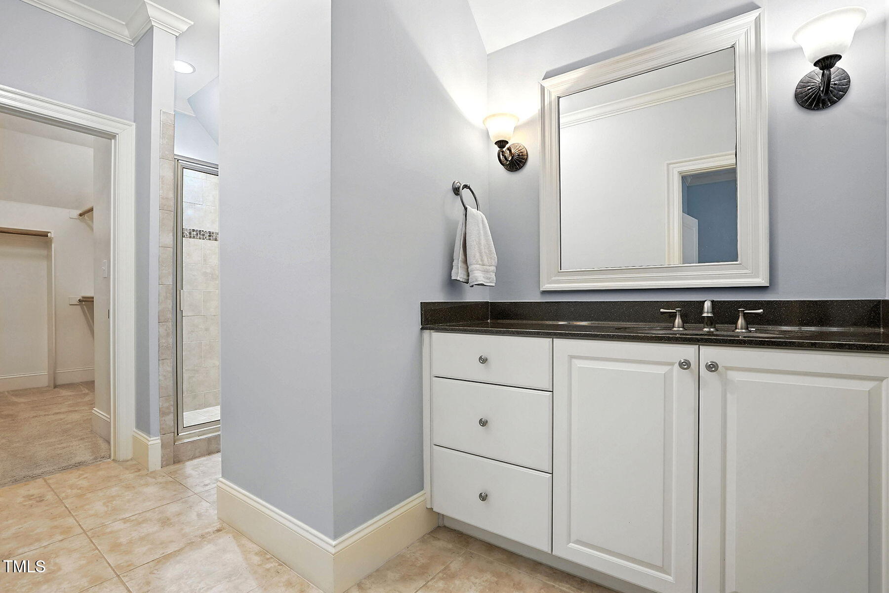 1605 Hunting Ridge Road Raleigh, NC 27615 - Photo 35 of 55 a bathroom with a sink and a mirror