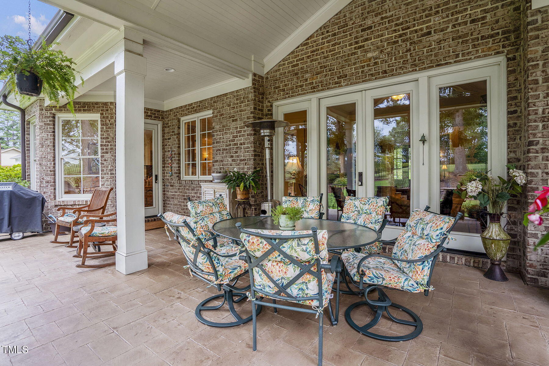 1605 Hunting Ridge Road Raleigh, NC 27615 - Photo 42 of 55 a view of a patio with couple of chairs and potted plants
