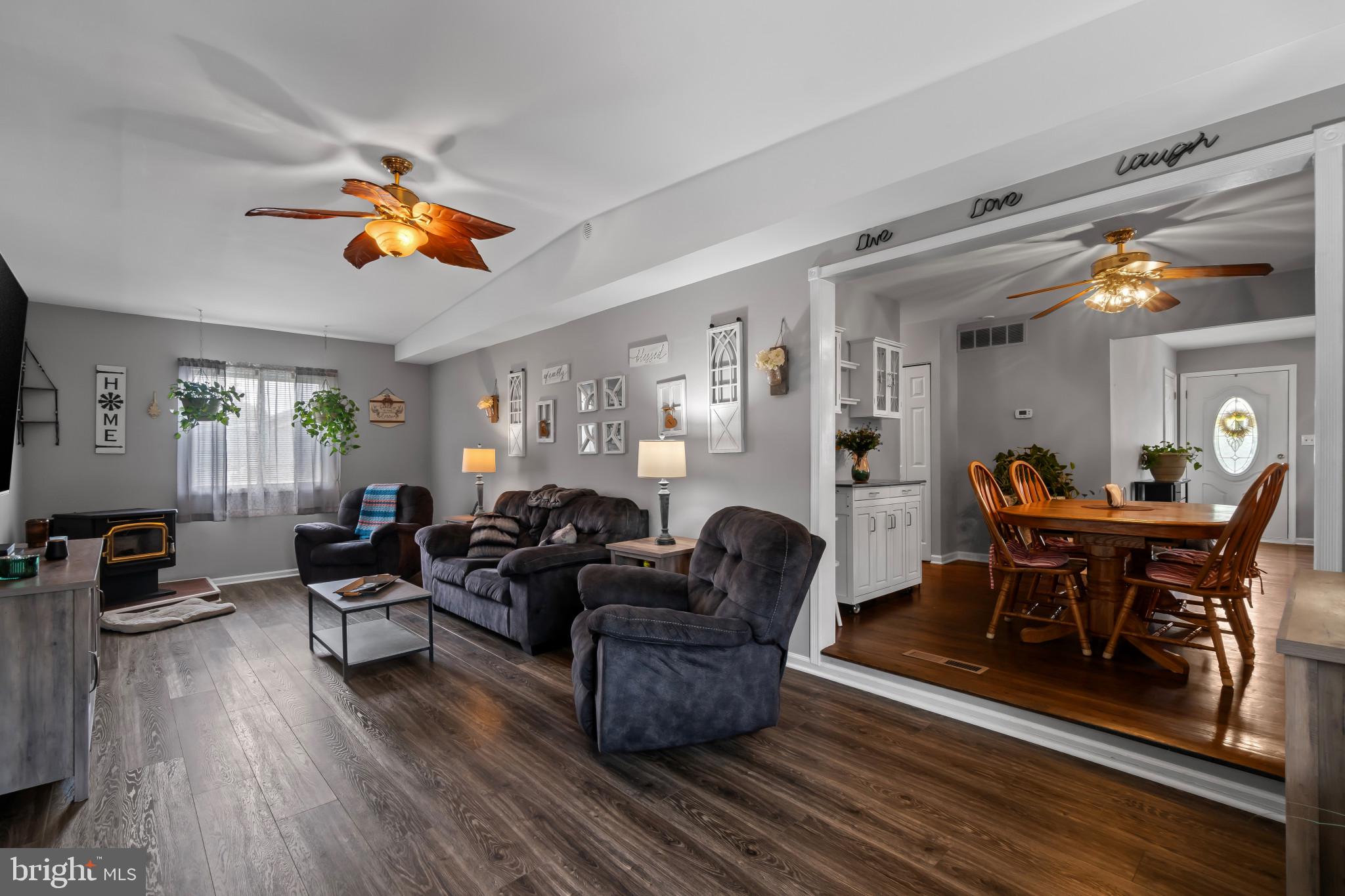 407 Bowleys Quarters Road Baltimore, MD 21220 - Photo 12 of 38 a living room with furniture and a wooden floor