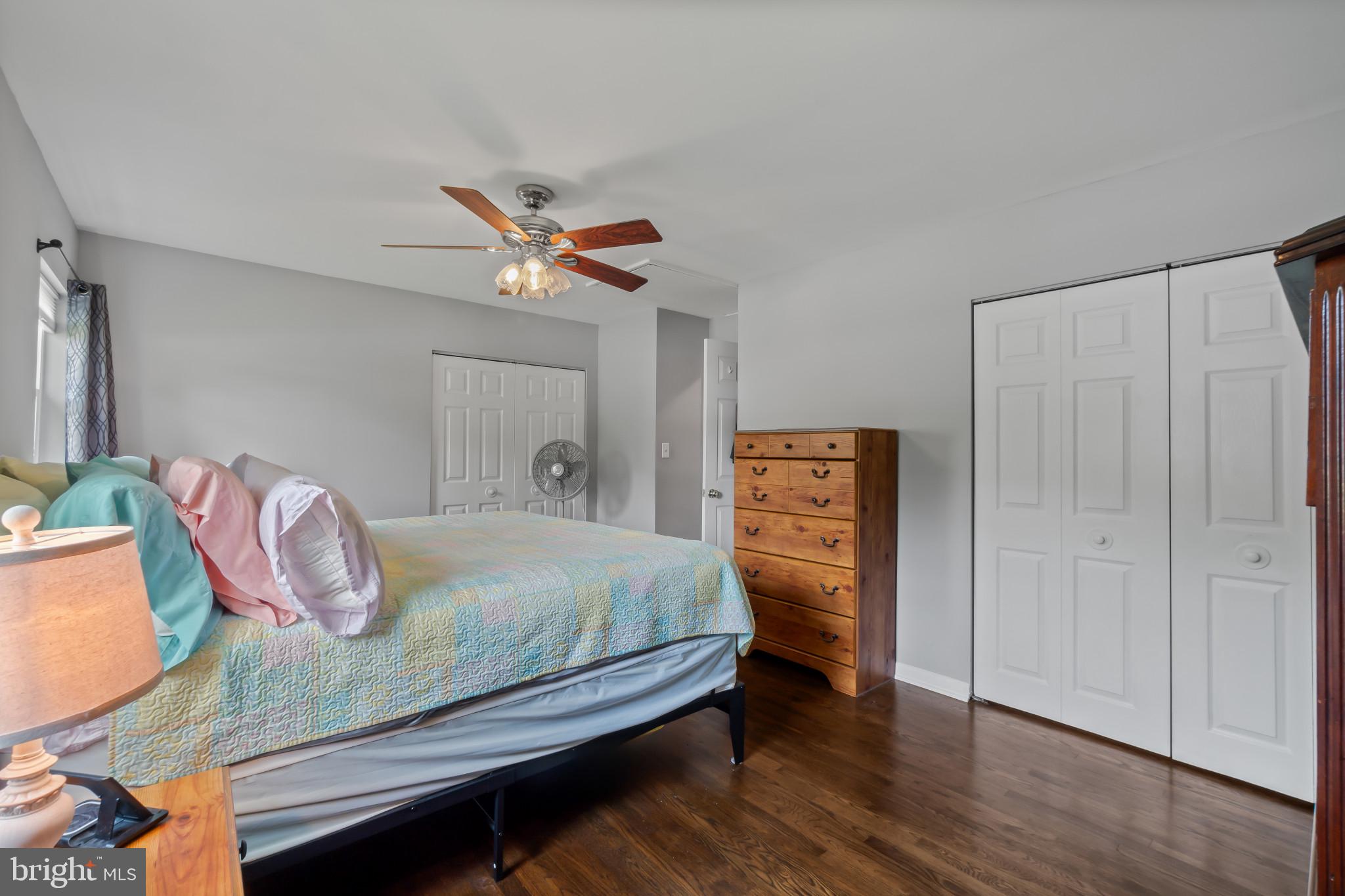 407 Bowleys Quarters Road Baltimore, MD 21220 - Photo 17 of 38 a bedroom with a bed and a chandelier