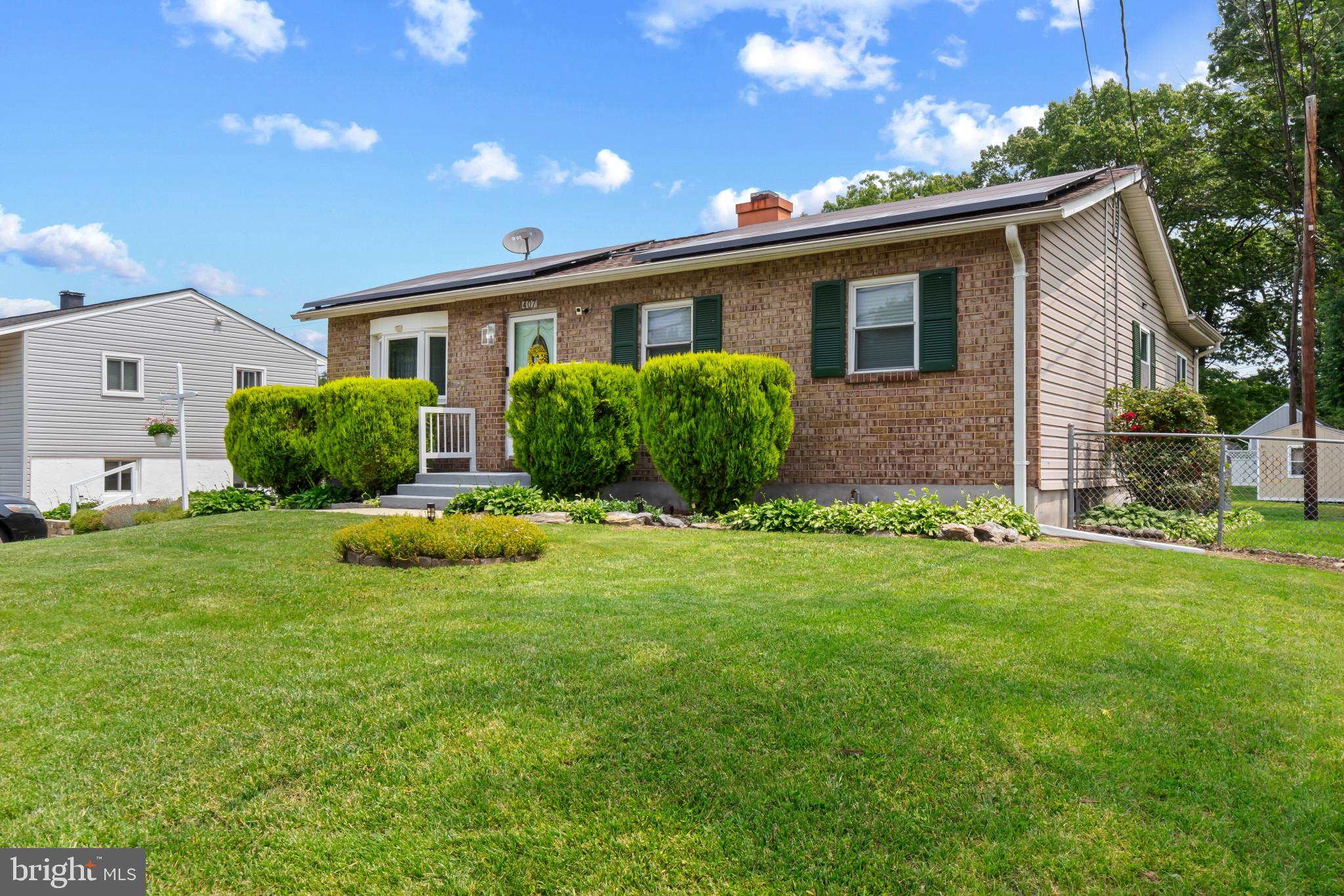 407 Bowleys Quarters Road Baltimore, MD 21220 - Photo 2 of 38 a view of a house with a yard and plants