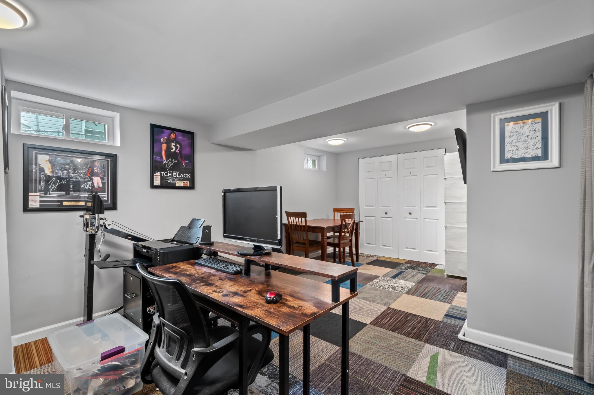 407 Bowleys Quarters Road Baltimore, MD 21220 - Photo 23 of 38 a view of a workspace with furniture and a window