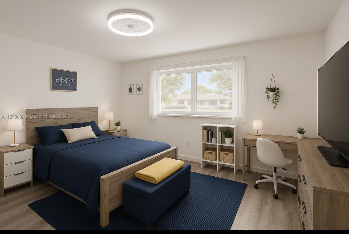 11301 Southwest 200th Street, Unit 306A Miami, FL 33157 - Photo 6 of 10 a bedroom with a bed and a window