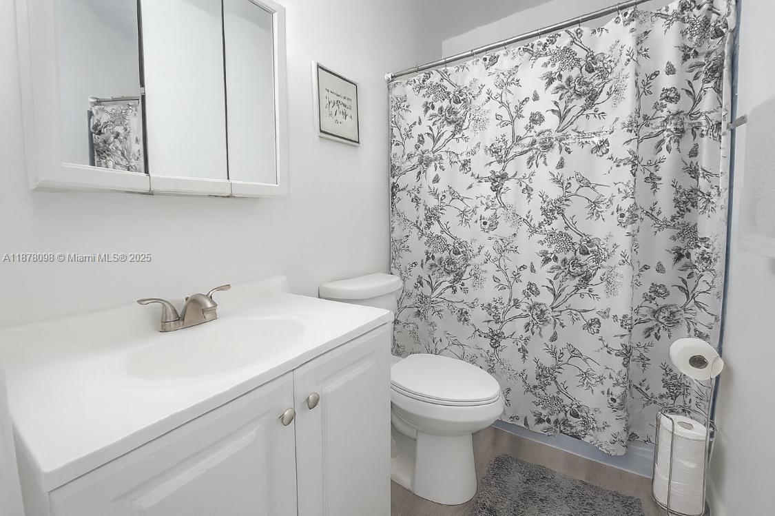 11301 Southwest 200th Street, Unit 306A Miami, FL 33157 - Photo 8 of 10 a bathroom with a sink and a toilet