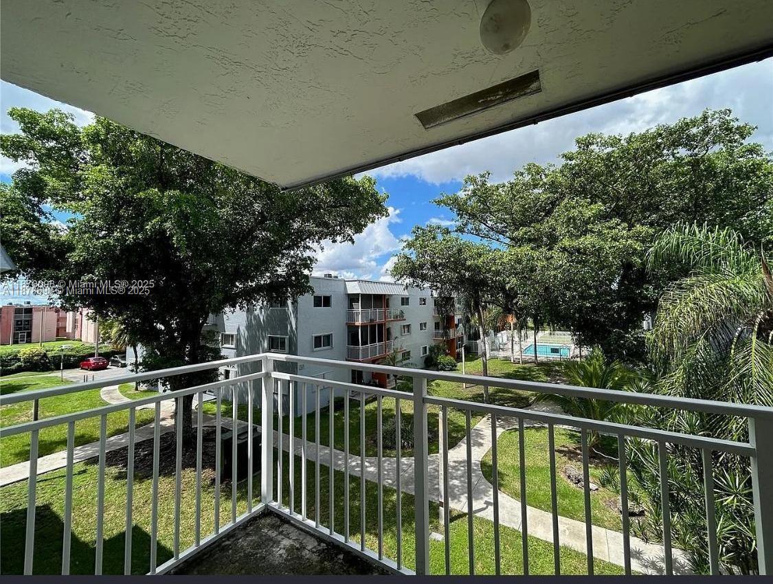 11301 Southwest 200th Street, Unit 306A Miami, FL 33157 - Photo 9 of 10 a view of a balcony with yard