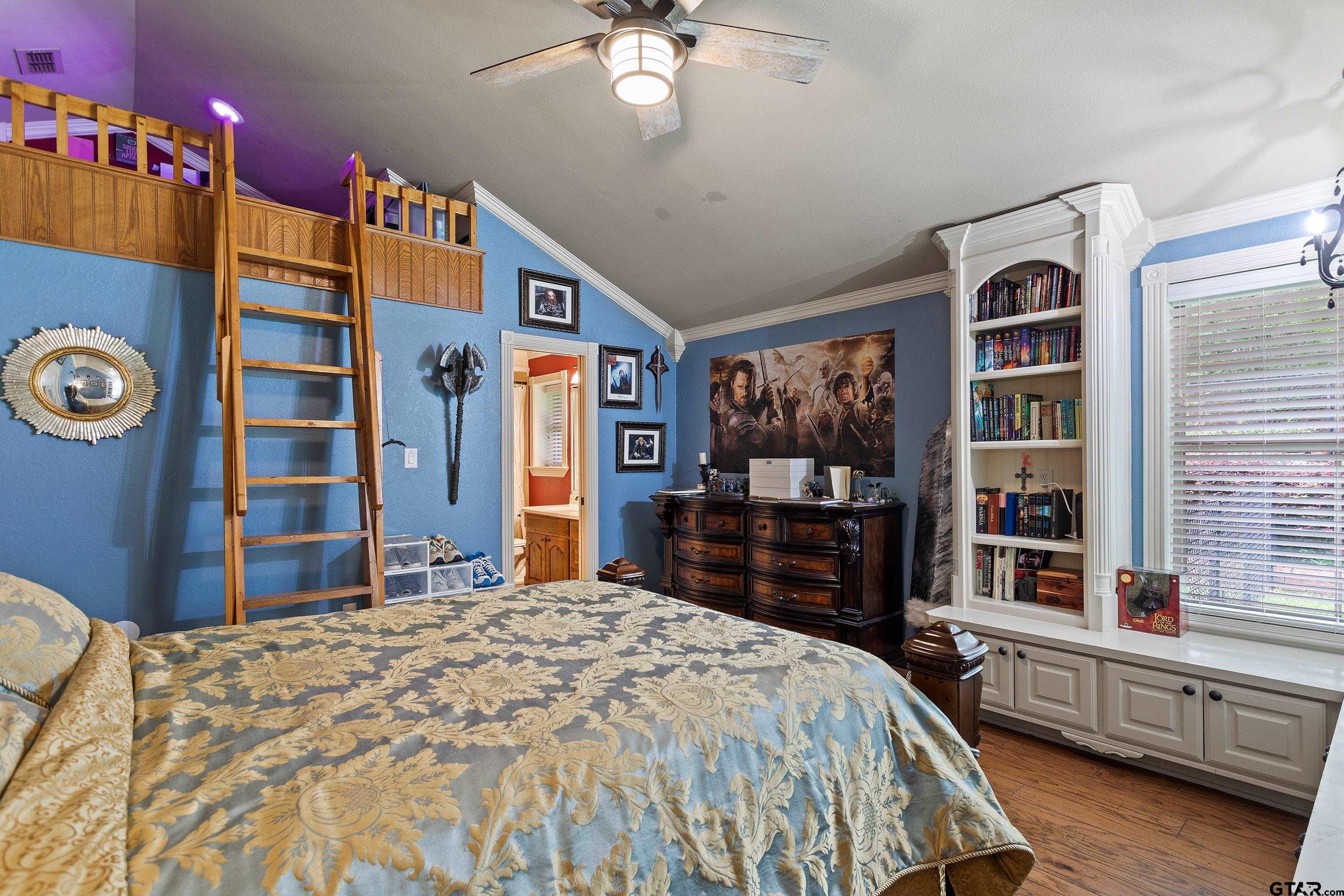 19678-c R 4125 C R 4125 Lindale, TX 75771 - Photo 30 of 48 a bedroom with a large bed and a chandelier