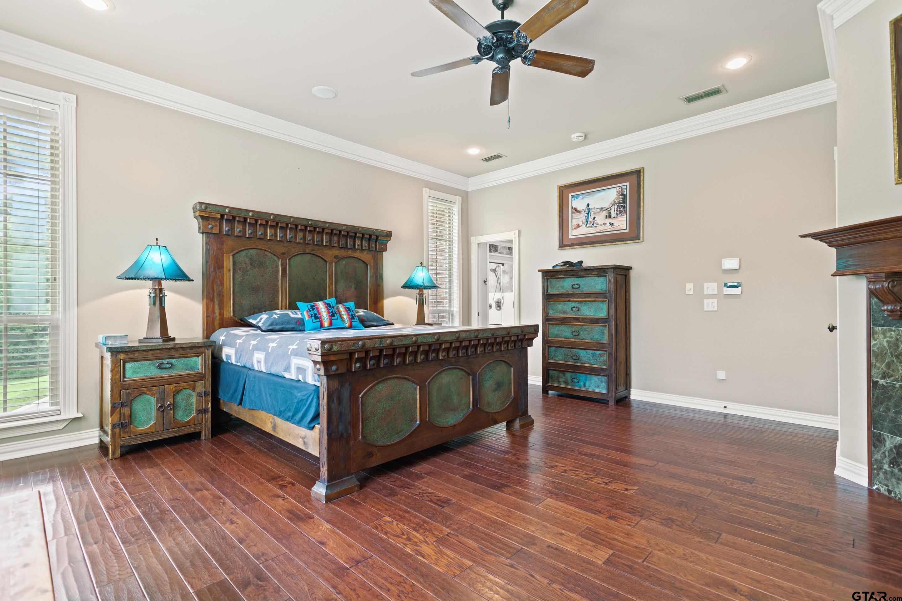 19678-c R 4125 C R 4125 Lindale, TX 75771 - Photo 4 of 48 a bedroom with a bed and wooden floor