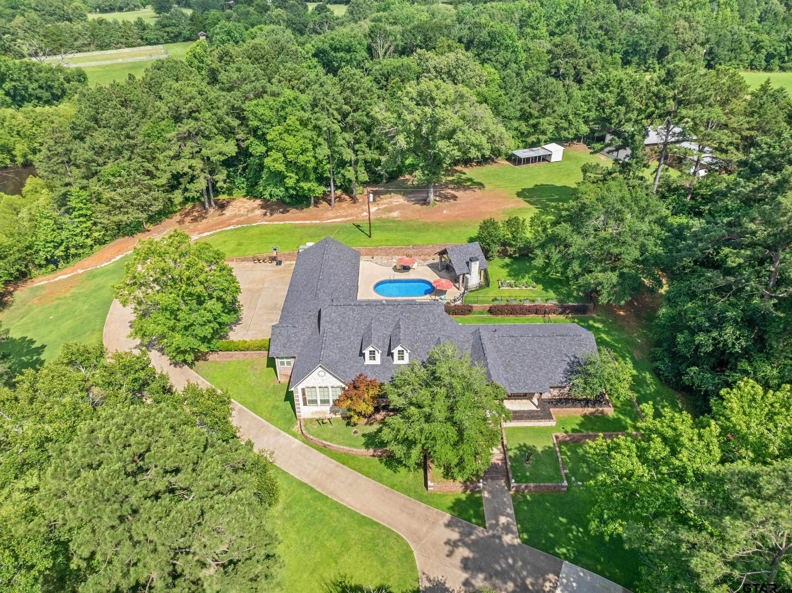 19678-c R 4125 C R 4125 Lindale, TX 75771 - Photo 43 of 48 an aerial view of a house with a garden