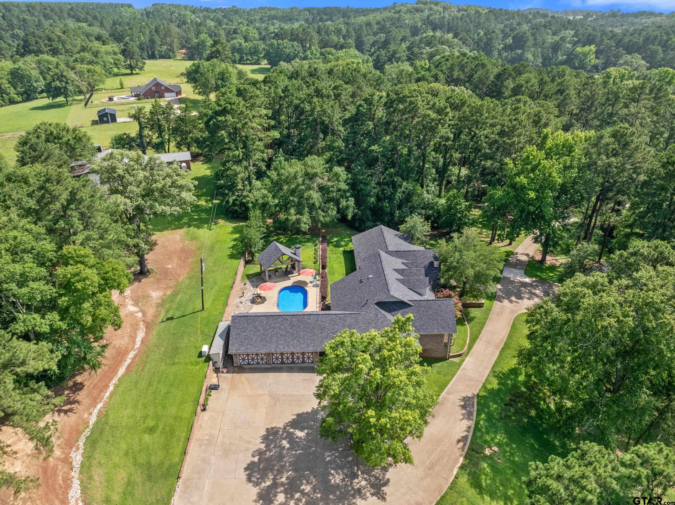 19678-c R 4125 C R 4125 Lindale, TX 75771 - Photo 44 of 48 an aerial view of a house with a yard