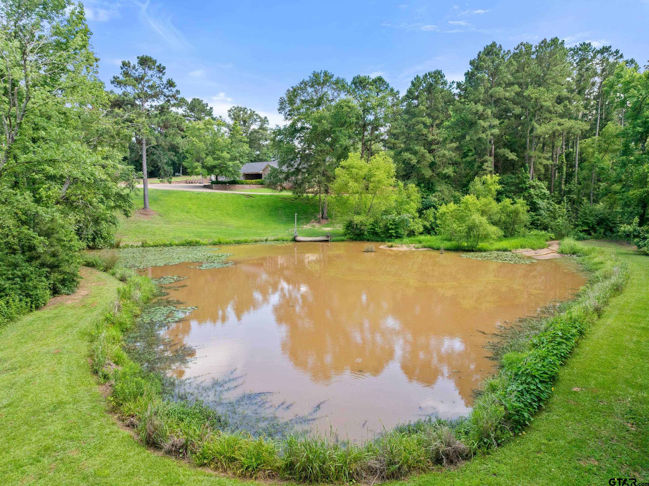 19678-c R 4125 C R 4125 Lindale, TX 75771 - Photo 7 of 48 an aerial view of a houses with a yard and lake view