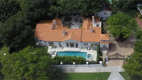 a view of a swimming pool with a patio