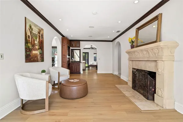 a living room with furniture and a fireplace