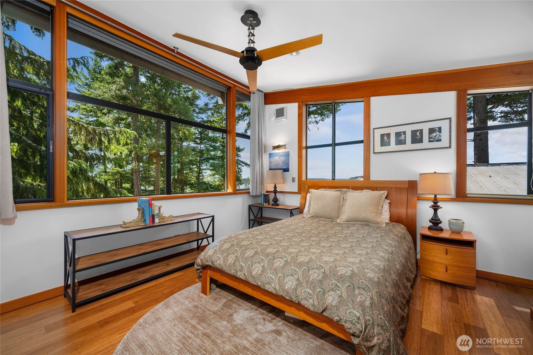 405 Northwest Thatcher Pass Road Decatur Island, WA 98221 - Photo 12 of 40 a bedroom with a bed and a large window with outer view