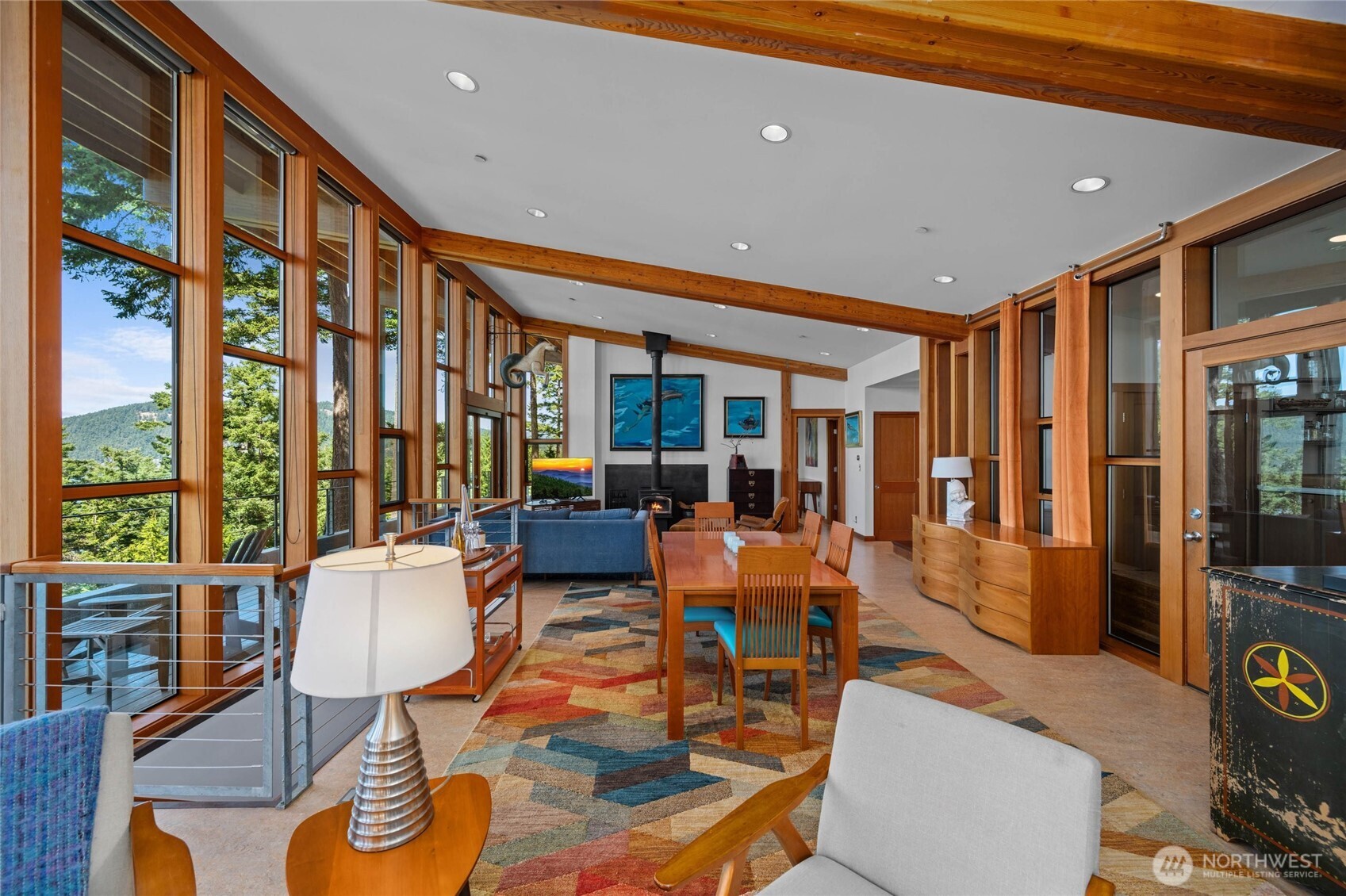 405 Northwest Thatcher Pass Road Decatur Island, WA 98221 - Photo 17 of 40 a living room with furniture and floor to ceiling windows