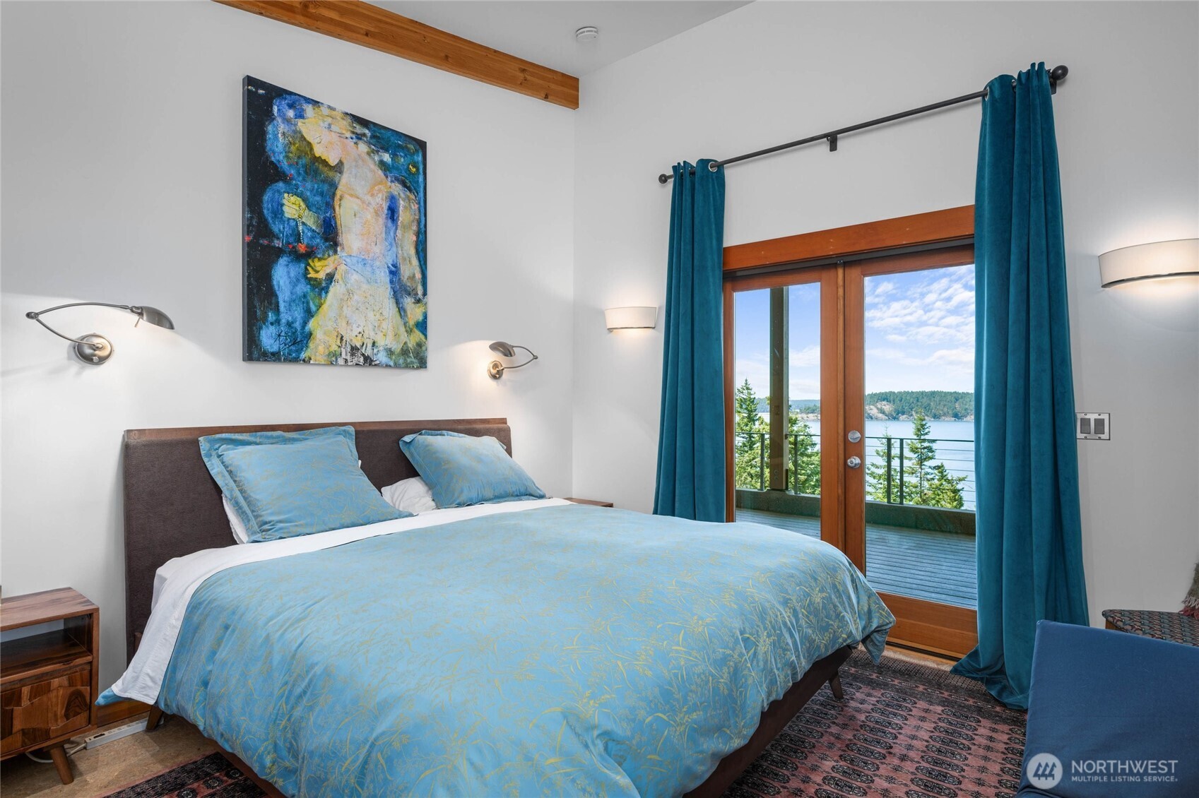 405 Northwest Thatcher Pass Road Decatur Island, WA 98221 - Photo 18 of 40 a bedroom with a bed and a painting on the wall