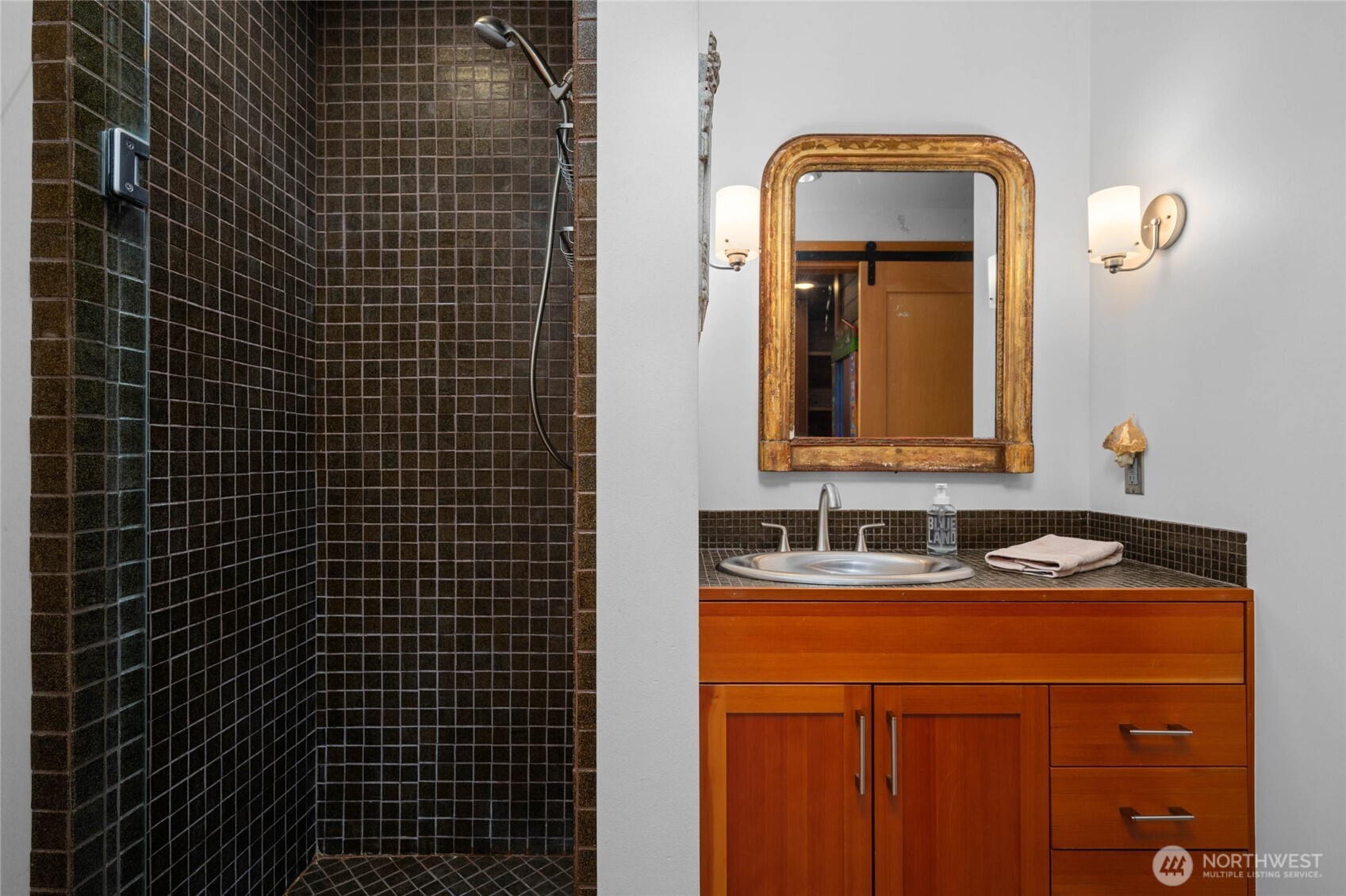 405 Northwest Thatcher Pass Road Decatur Island, WA 98221 - Photo 21 of 40 a bathroom with a sink and a mirror