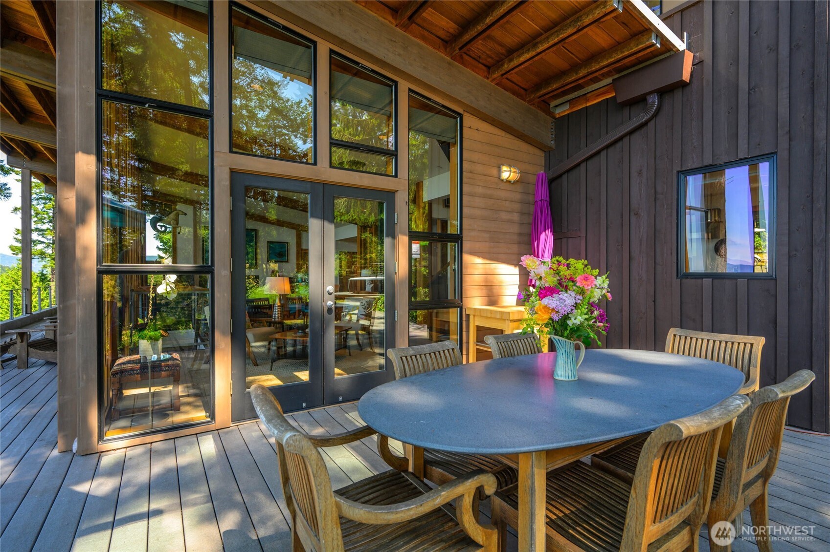 405 Northwest Thatcher Pass Road Decatur Island, WA 98221 - Photo 23 of 40 a view of a dining room with furniture and outdoor space