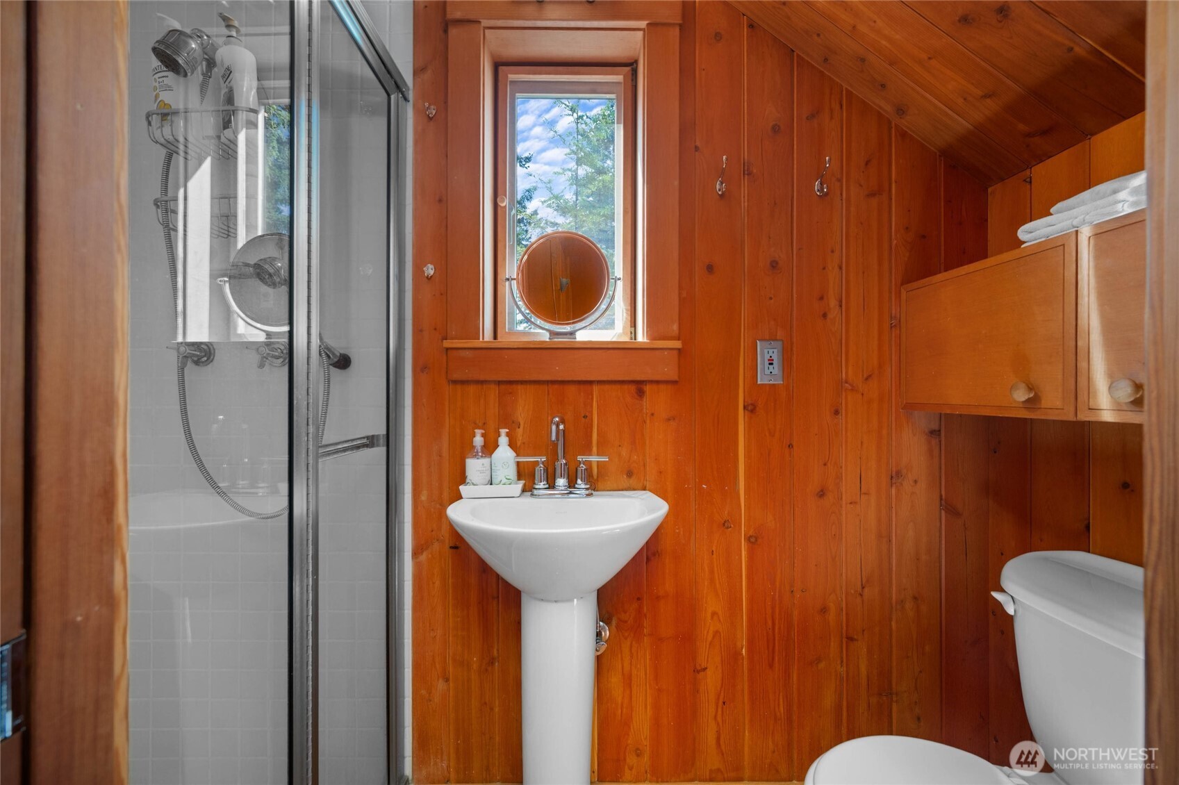 405 Northwest Thatcher Pass Road Decatur Island, WA 98221 - Photo 31 of 40 a bathroom with a sink mirror toilet and shower