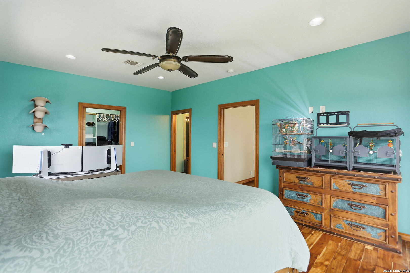 232 Doe Run Road Pipe Creek, TX 78063 - Photo 13 of 40 a bedroom with a bed and a dresser in it