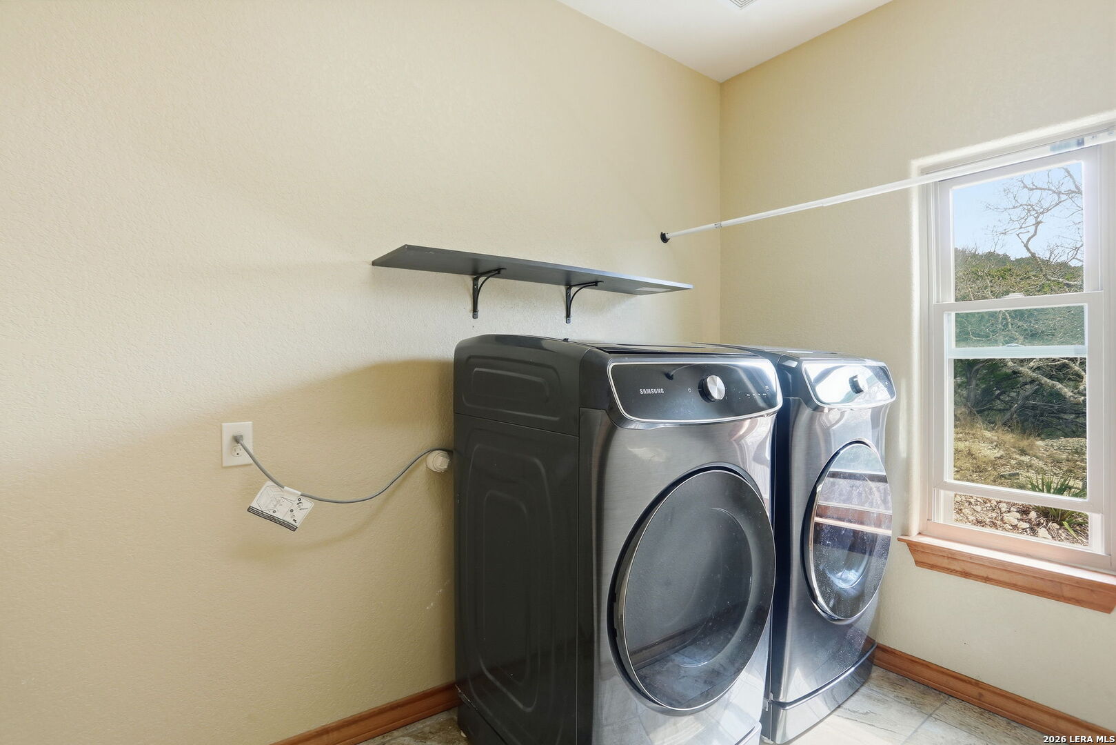 232 Doe Run Road Pipe Creek, TX 78063 - Photo 24 of 40 a utility room with dryer and washer
