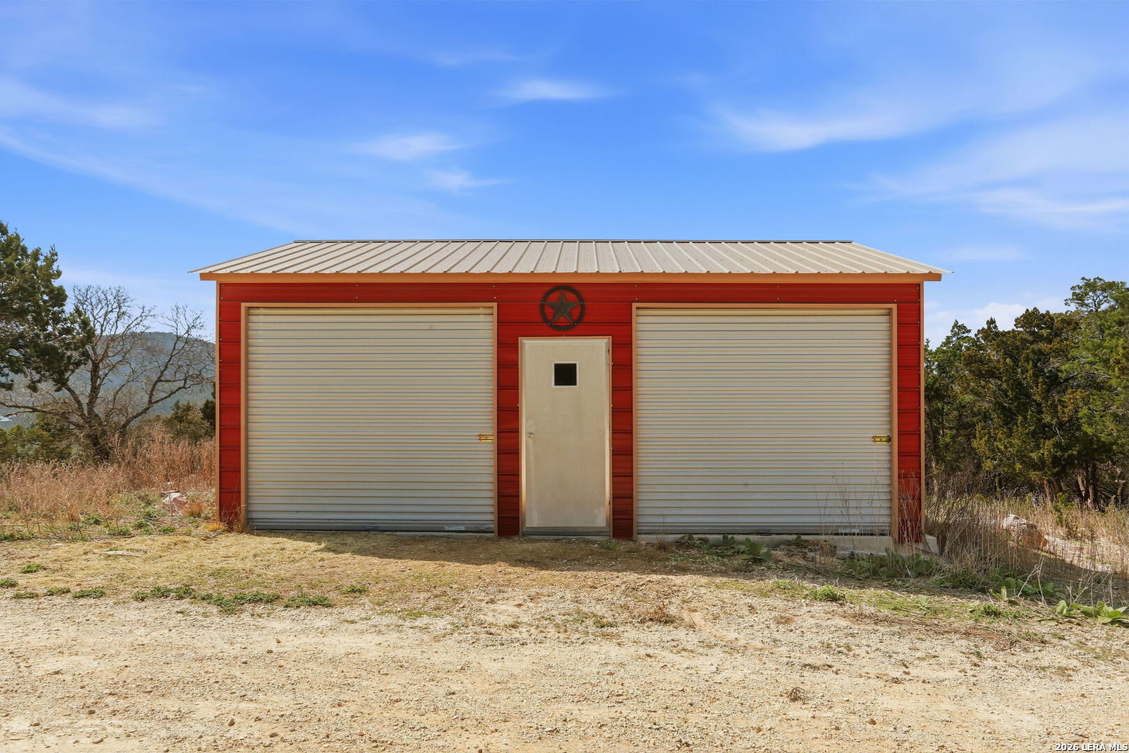 232 Doe Run Road Pipe Creek, TX 78063 - Photo 30 of 40 a front view of a house with a garage