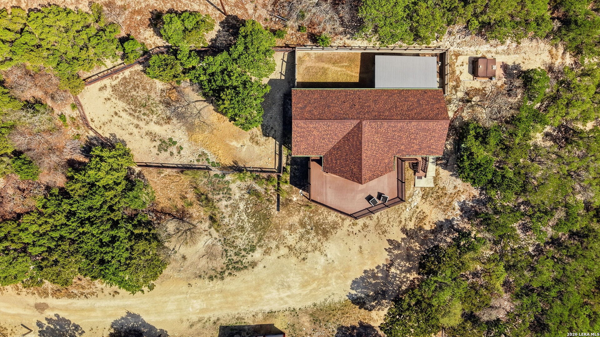 232 Doe Run Road Pipe Creek, TX 78063 - Photo 32 of 40 aerial view of a house with a yard