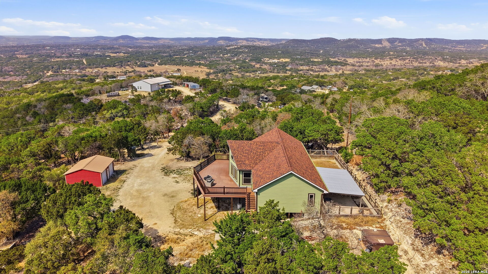 232 Doe Run Road Pipe Creek, TX 78063 - Photo 33 of 40 an aerial view of a house with a mountain