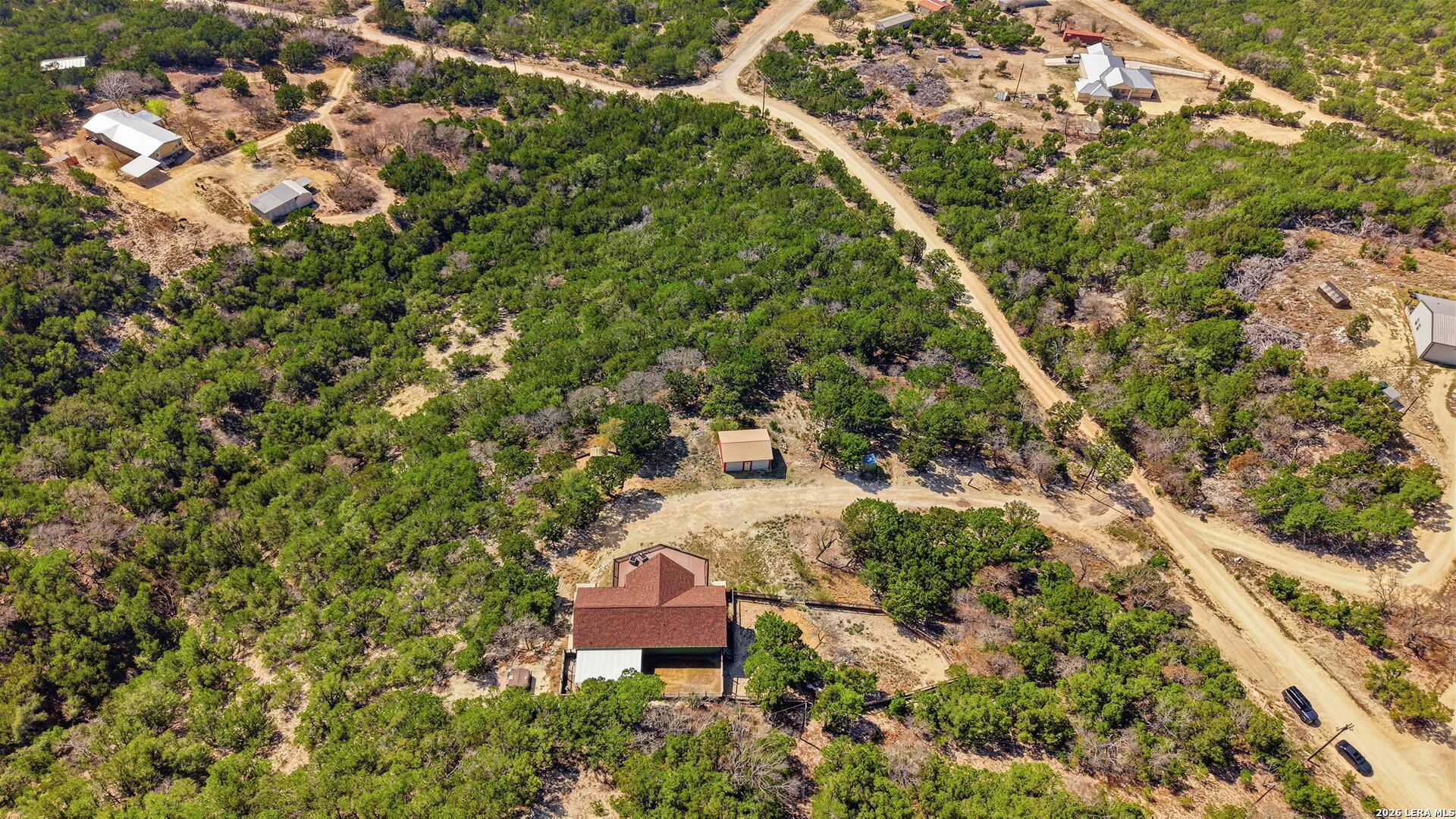 232 Doe Run Road Pipe Creek, TX 78063 - Photo 36 of 40 an aerial view of a house with a yard