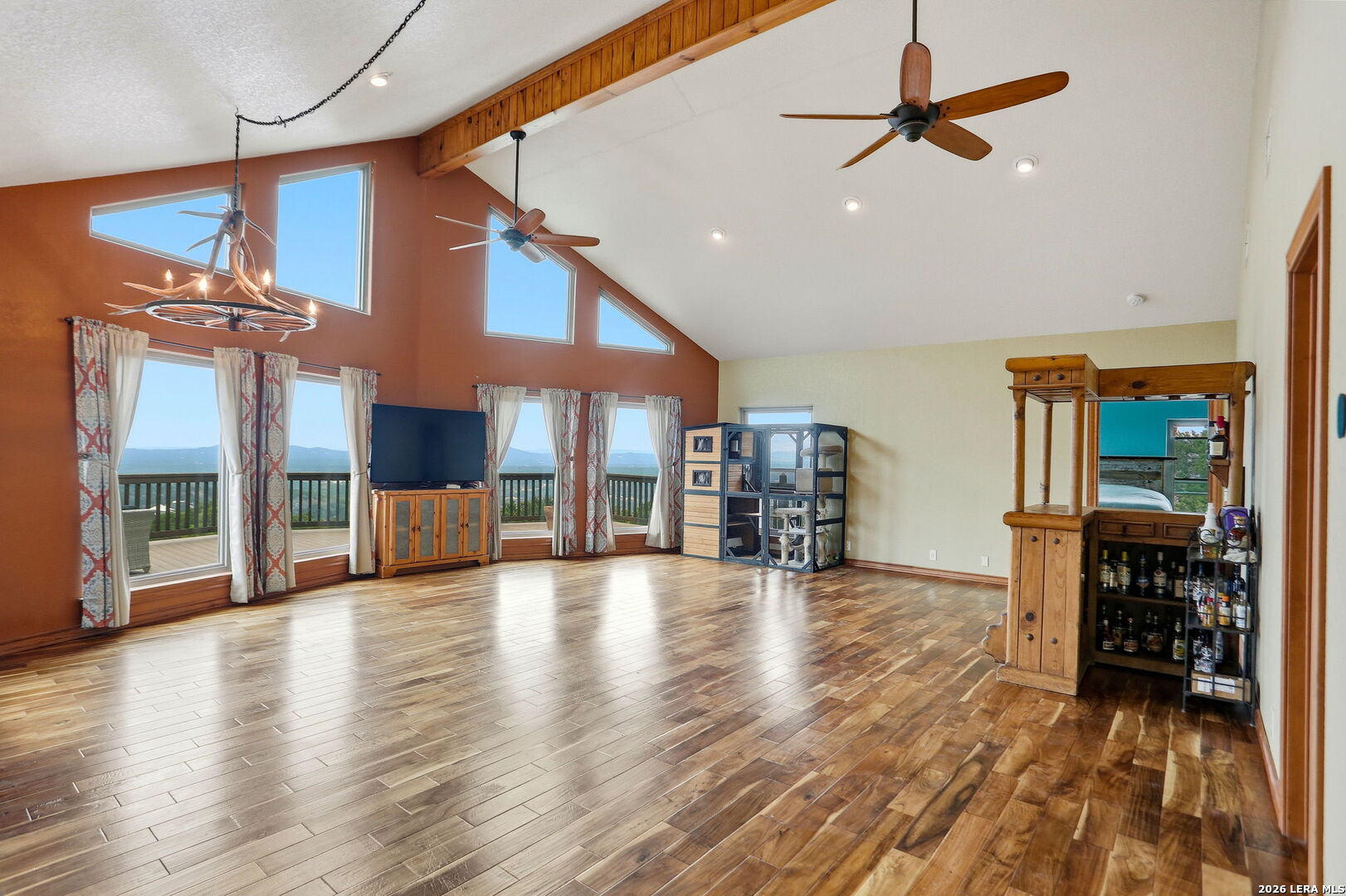 232 Doe Run Road Pipe Creek, TX 78063 - Photo 7 of 40 a view of a building stairs and a wooden floor