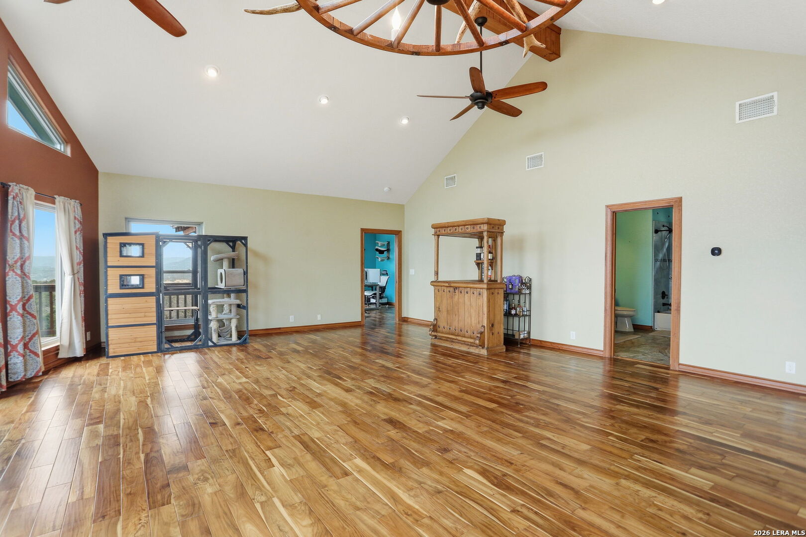 232 Doe Run Road Pipe Creek, TX 78063 - Photo 8 of 40 a view of empty room with a ceiling fan and window