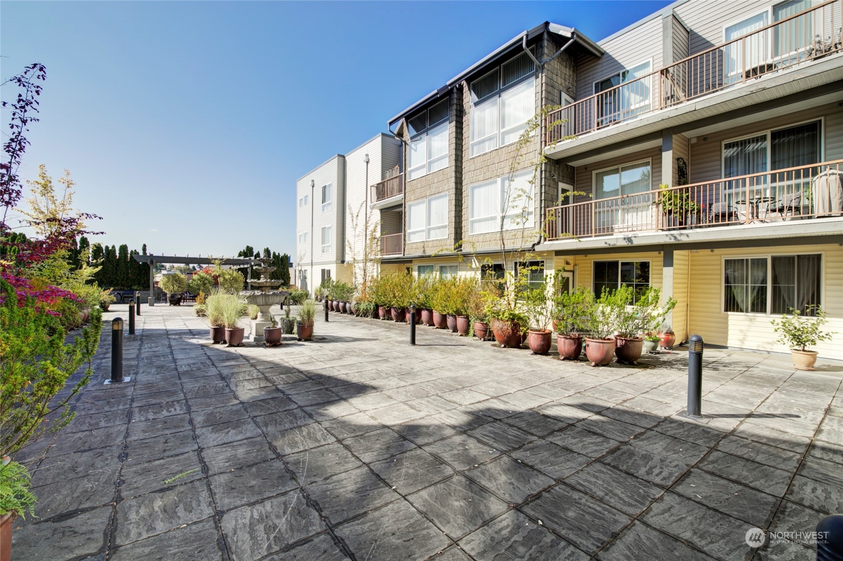 225 Logan Avenue South, Unit 108 Renton, WA 98057 - Photo 14 of 23 a view of a building with sitting area