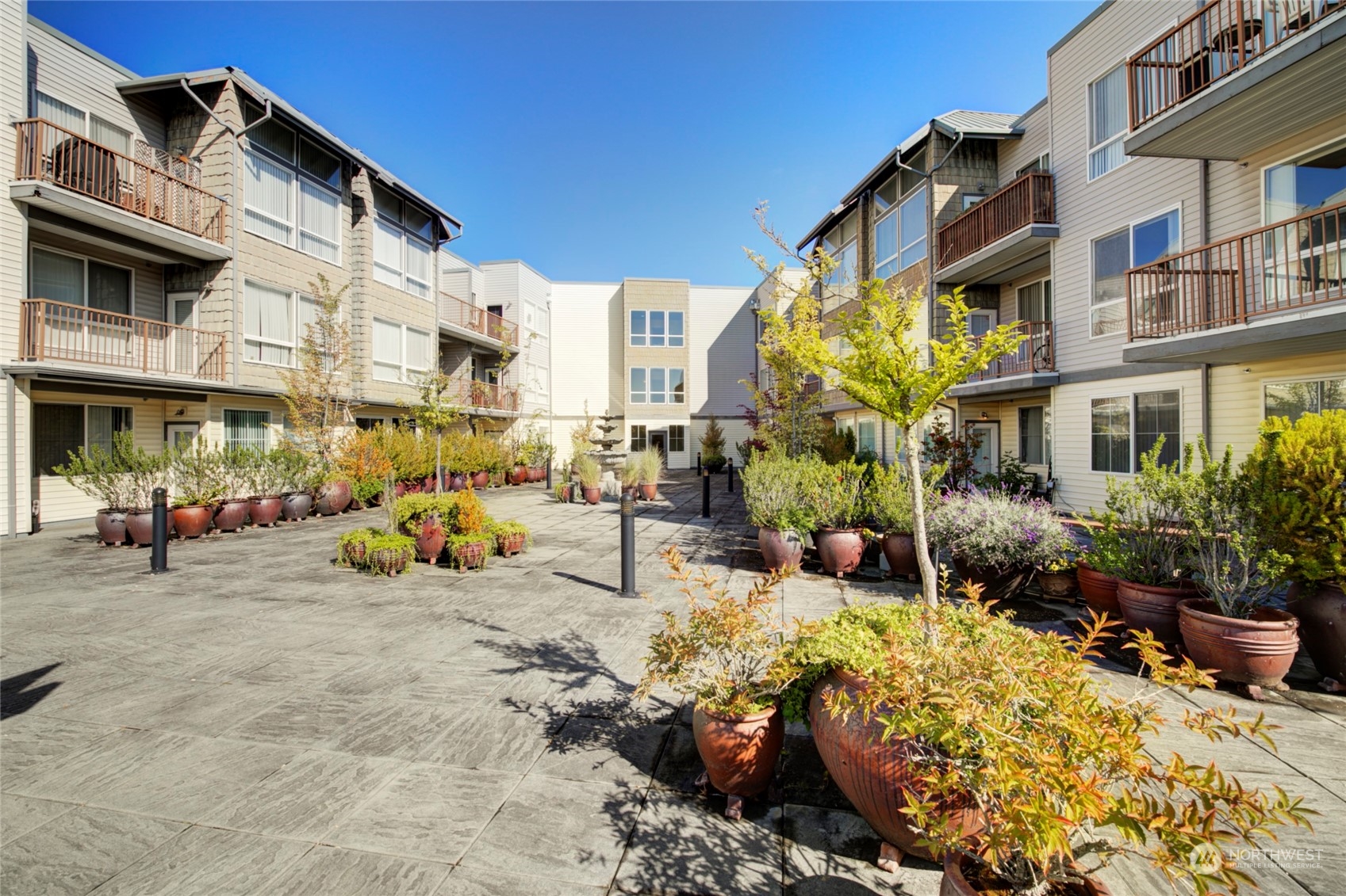 225 Logan Avenue South, Unit 108 Renton, WA 98057 - Photo 15 of 23 a view of a building with sitting area