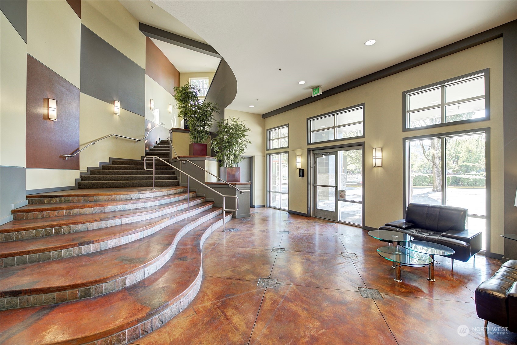 225 Logan Avenue South, Unit 108 Renton, WA 98057 - Photo 18 of 23 a living room with furniture and a floor to ceiling window