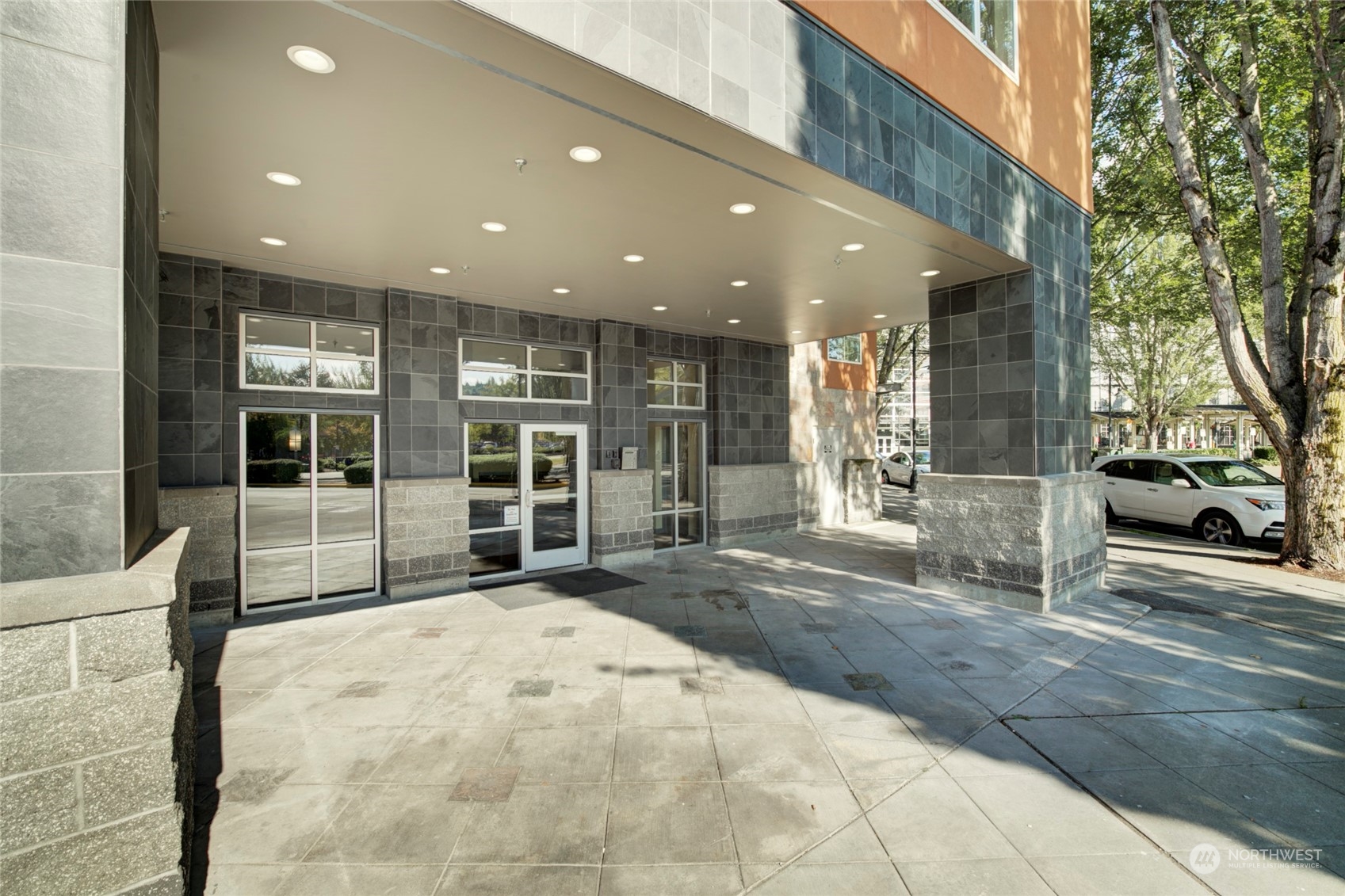 225 Logan Avenue South, Unit 108 Renton, WA 98057 - Photo 2 of 23 a view of a building with the porch