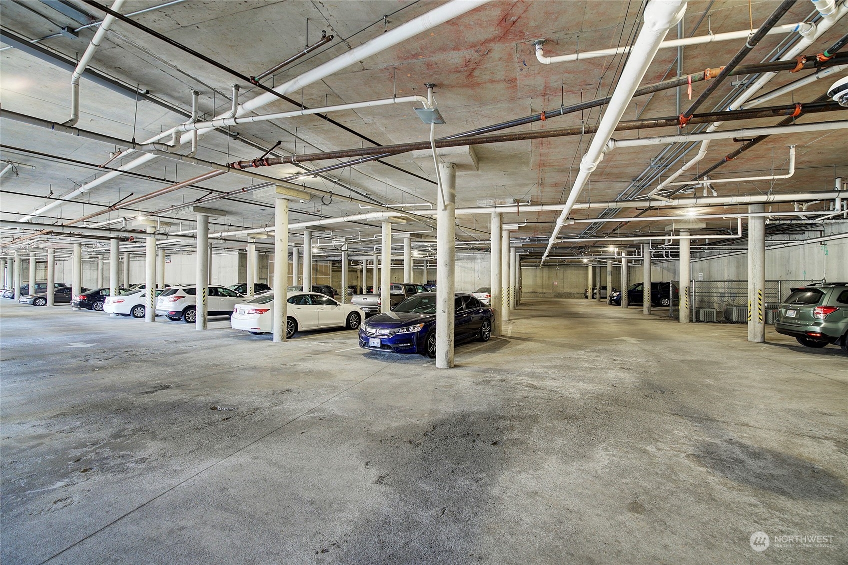 225 Logan Avenue South, Unit 108 Renton, WA 98057 - Photo 4 of 23 a view of a garage with cars