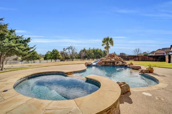 a view of a swimming pool with an ocean view
