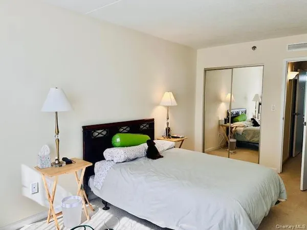 a bedroom with a bed and a table