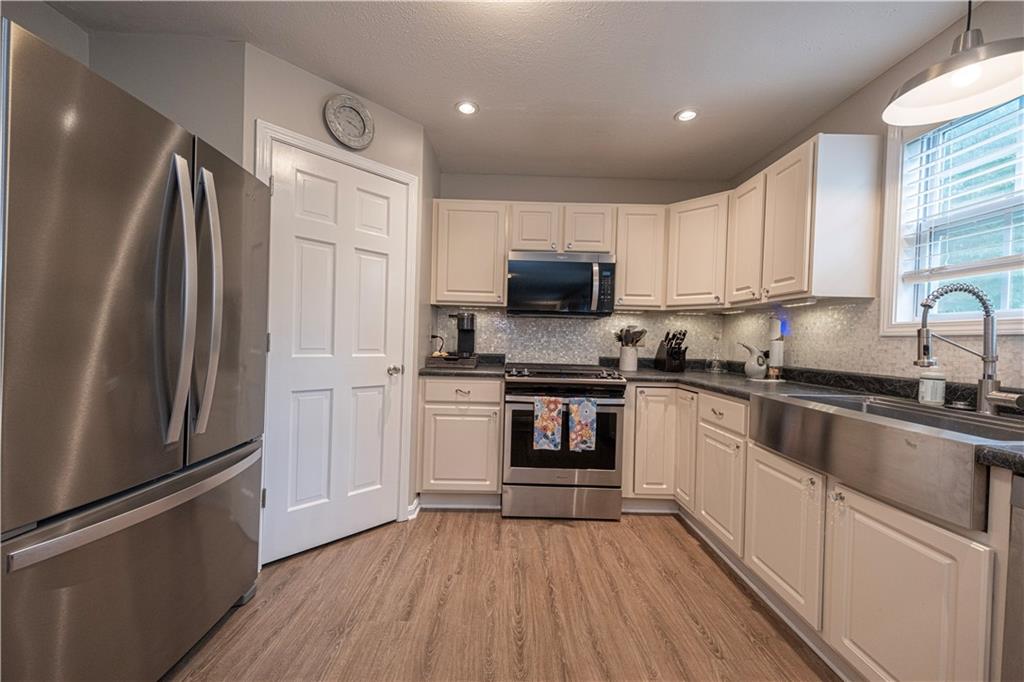 435 Cottage Lane Monroeville, PA 15146 - Photo 8 of 46 Newer microwave, dishwasher, and garbage disposal make meal prep and cleanup a breeze—plus you'll love the oversized stainless-steel sink