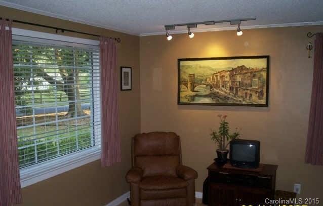 4614 Connecting Road Charlotte, NC 28209 - Photo 2 of 5 a room with furniture and a window