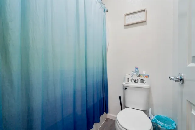 a bedroom with bed and a window