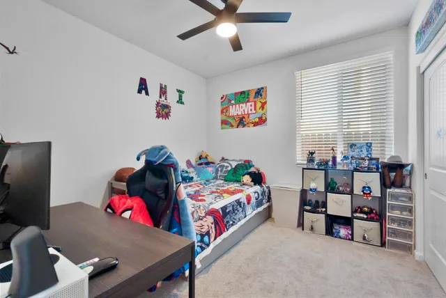 a bedroom with a bed and a couch