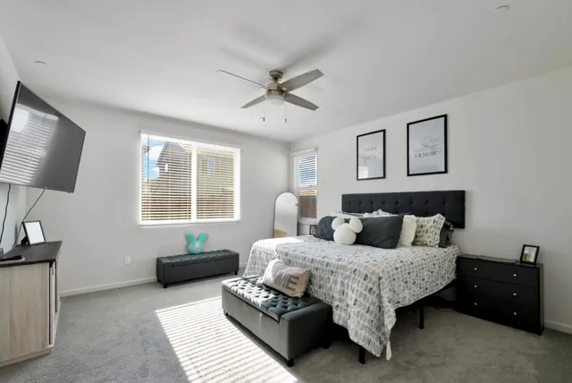 a spacious bathroom with a granite countertop sink a mirror and a shower