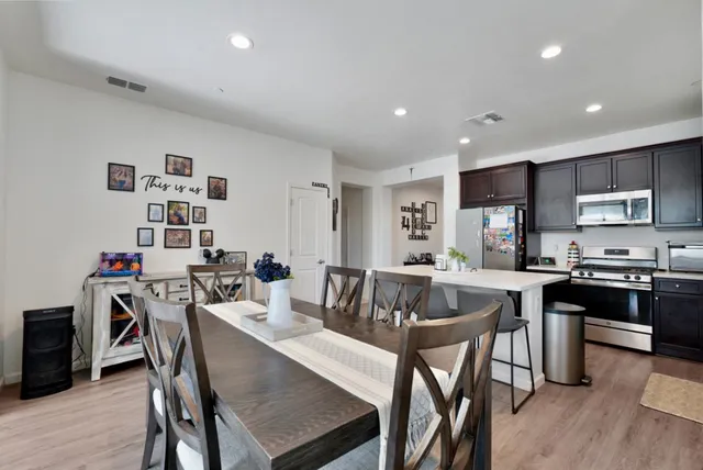 a kitchen with a table and chairs in it