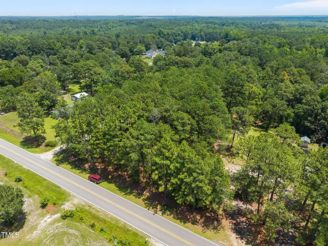 a view of a garden with an outdoor seating area
