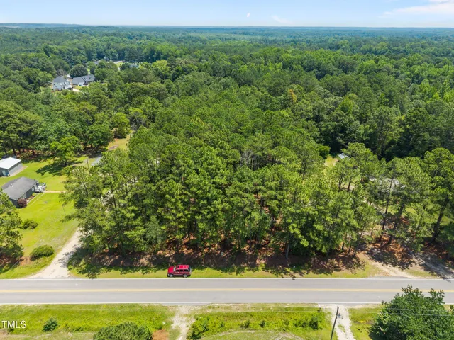 a view of a yard with an outdoor seating