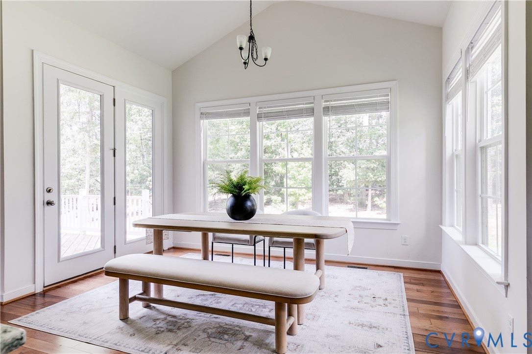 2512 Channelmark Court Chester, VA 23836 - Photo 14 of 36 Dining are with vaulted ceiling and natural light