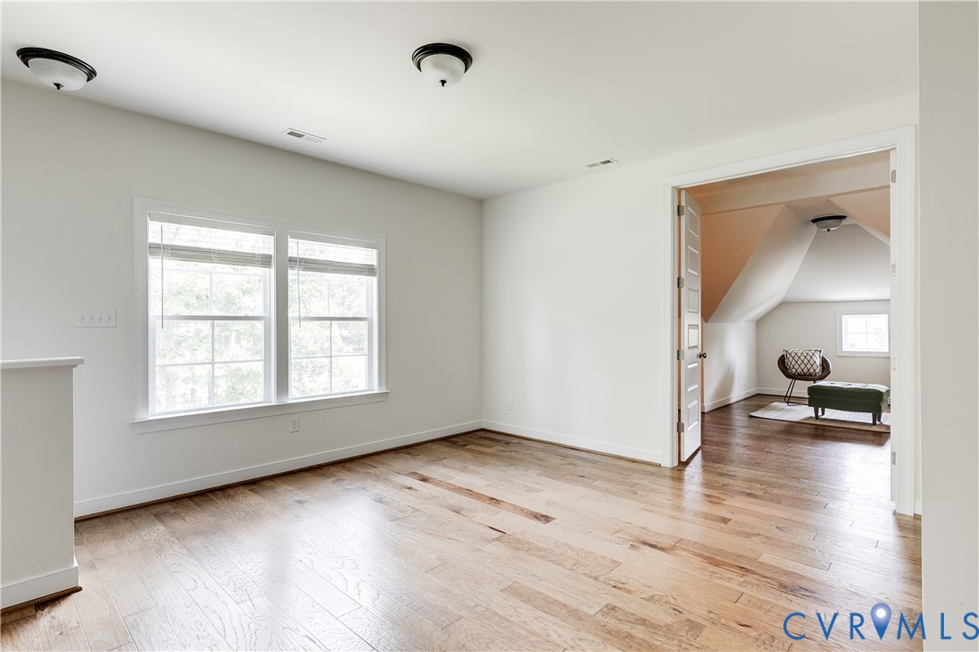 2512 Channelmark Court Chester, VA 23836 - Photo 21 of 36 Second story landing from back staircase in the ki