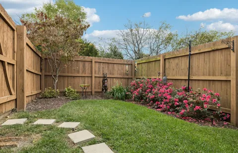 a view of a backyard with a fountain